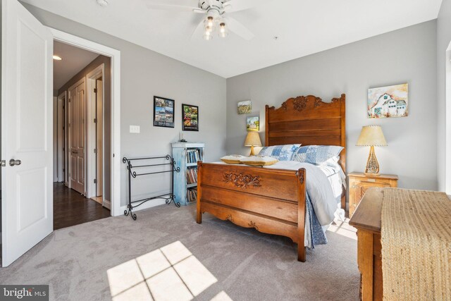 carpeted bedroom with a ceiling fan