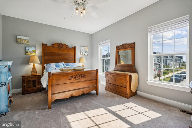 bedroom with visible vents, ceiling fan, carpet, and baseboards