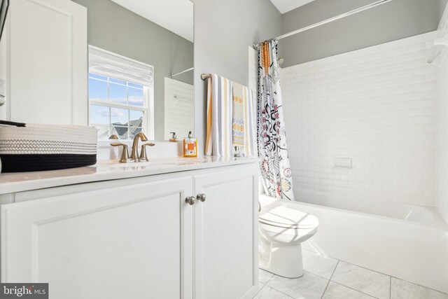 full bath featuring vanity, tile patterned floors, toilet, and shower / bathtub combination with curtain