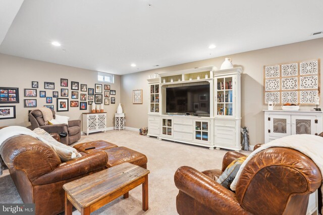 living area featuring visible vents, recessed lighting, light colored carpet, and baseboards