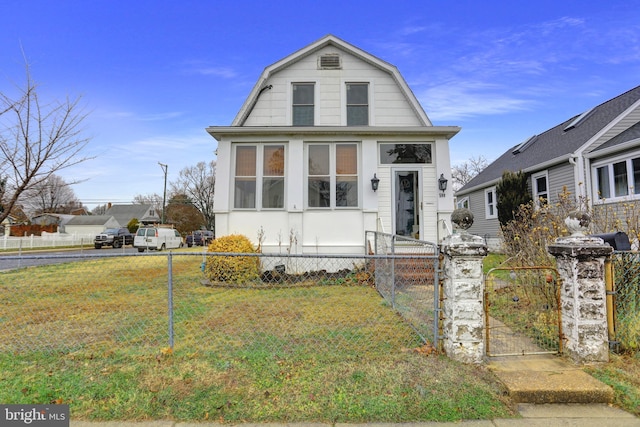 500 Dorsey Ave, Essex, MD 21221 - dutch colonial featuring a gambrel roof, a fenced front yard, and a gate