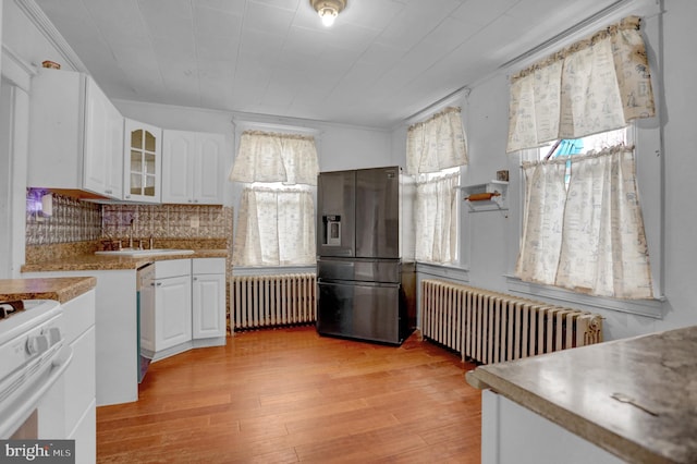500 Dorsey Ave, Essex, MD 21221 - kitchen with radiator, stainless steel fridge with ice dispenser, and plenty of natural light