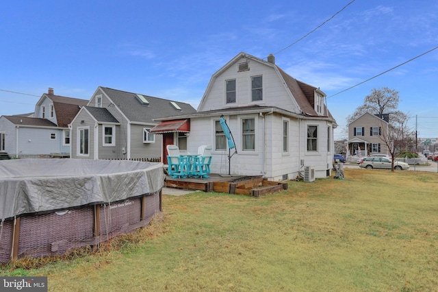 500 Dorsey Ave, Essex, MD 21221 - back of property with a lawn, a gambrel roof, and a chimney