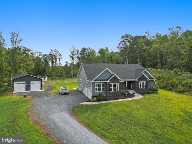 view of front of house with an outdoor structure, a front yard, and a garage