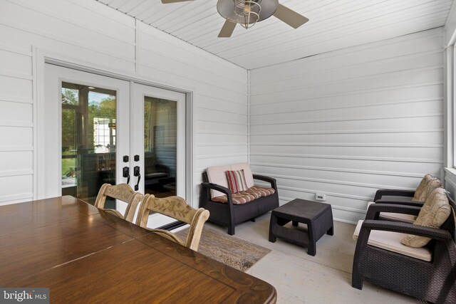 sunroom featuring ceiling fan, wooden ceiling, and french doors