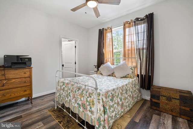 bedroom featuring ceiling fan and dark wood-type flooring