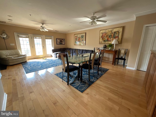 dining space featuring crown molding, ceiling fan, and light hardwood / wood-style floors