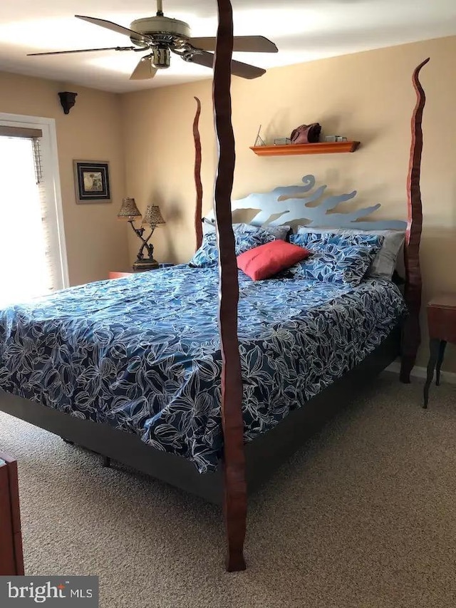 carpeted bedroom with ceiling fan