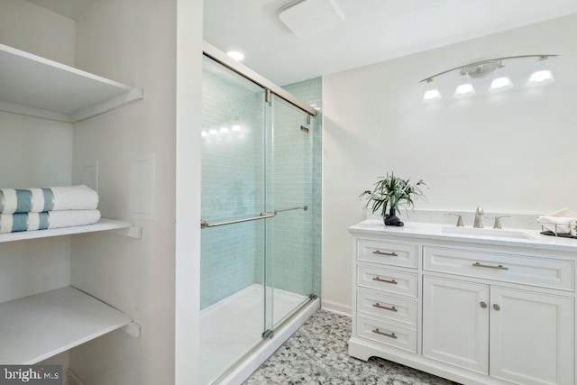 bathroom featuring an enclosed shower and vanity