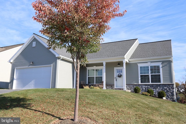 view of front of property with a front lawn, stone siding, a porch, roof with shingles, and a garage