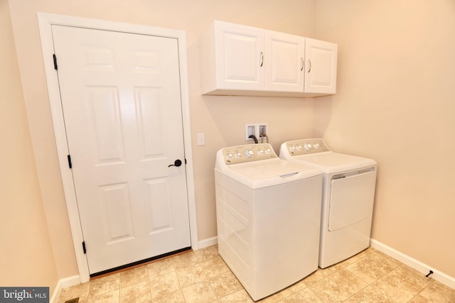 laundry area with cabinets and washer and dryer