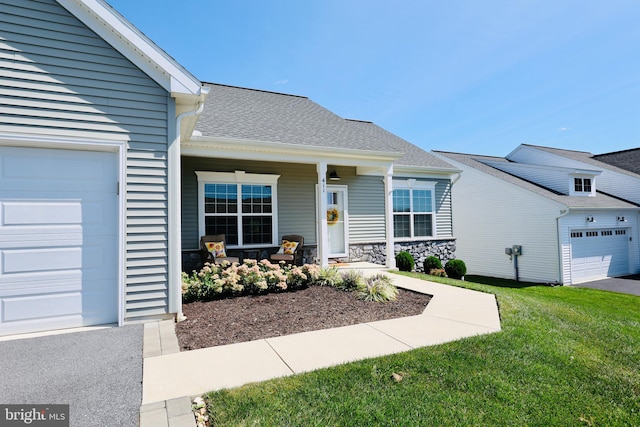 view of front of house featuring a garage and a front lawn