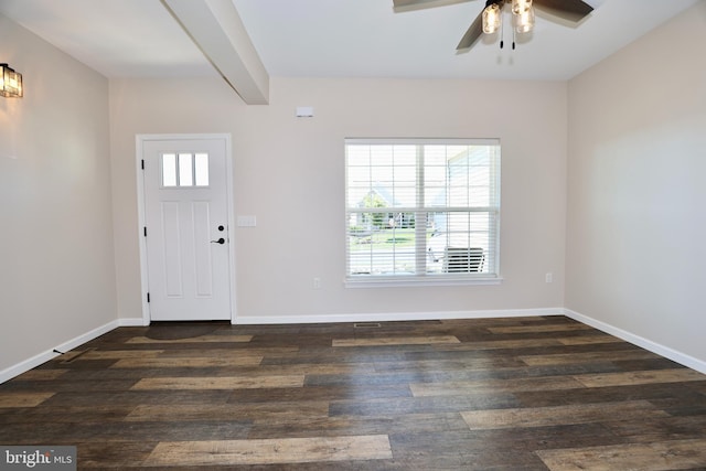 entrance foyer with dark wood-type flooring, ceiling fan, and beam ceiling