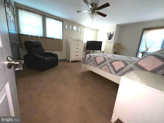 carpeted bedroom featuring ceiling fan