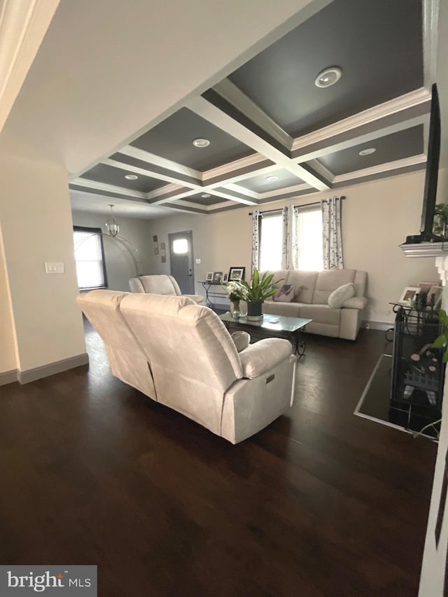 living room with coffered ceiling, hardwood / wood-style flooring, crown molding, and beamed ceiling