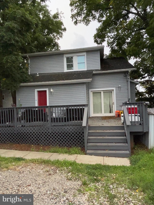 rear view of property with a deck