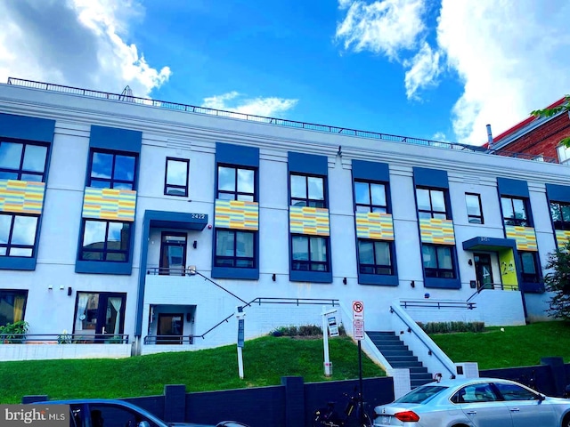 view of building exterior featuring stairs