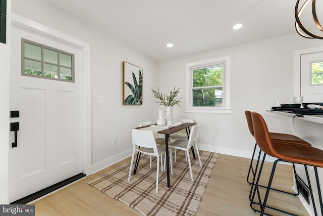 dining space featuring light wood-type flooring