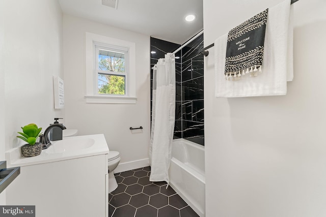 full bathroom featuring tile patterned flooring, vanity, toilet, and shower / tub combo