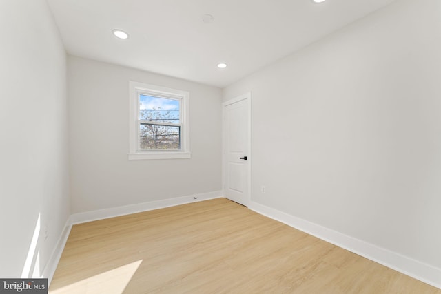 spare room featuring light hardwood / wood-style floors