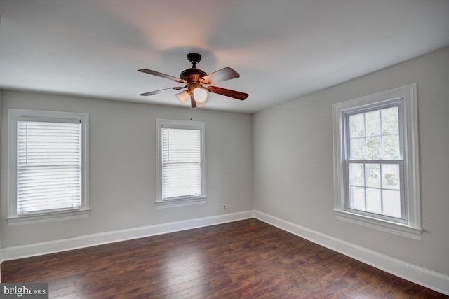 unfurnished room featuring dark hardwood / wood-style flooring and ceiling fan