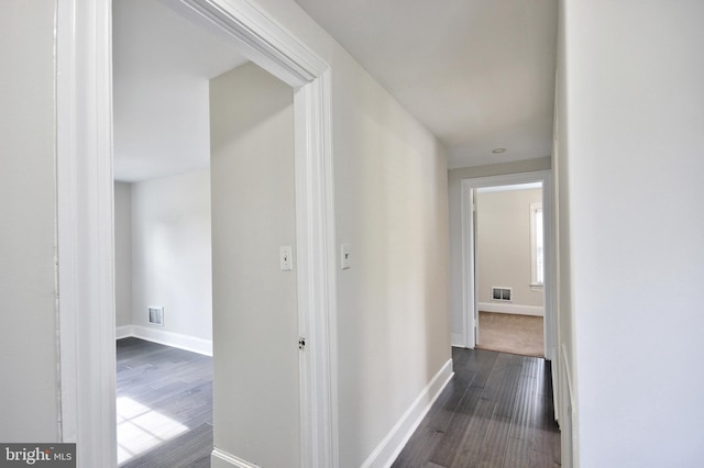 hall with dark hardwood / wood-style floors