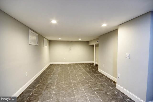 basement with dark tile patterned flooring