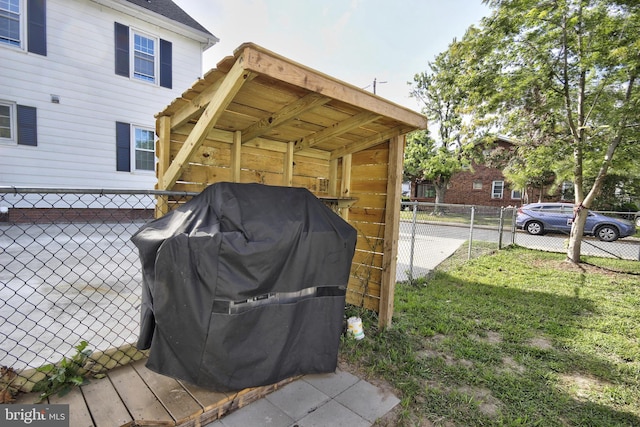 exterior space with a yard and area for grilling