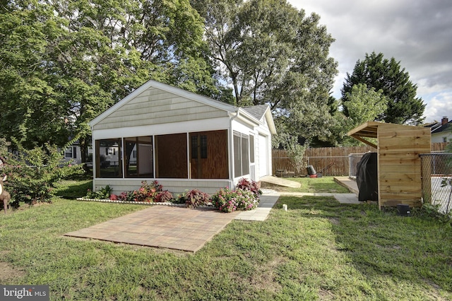 exterior space featuring a sunroom