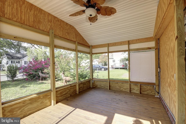 unfurnished sunroom featuring vaulted ceiling and ceiling fan