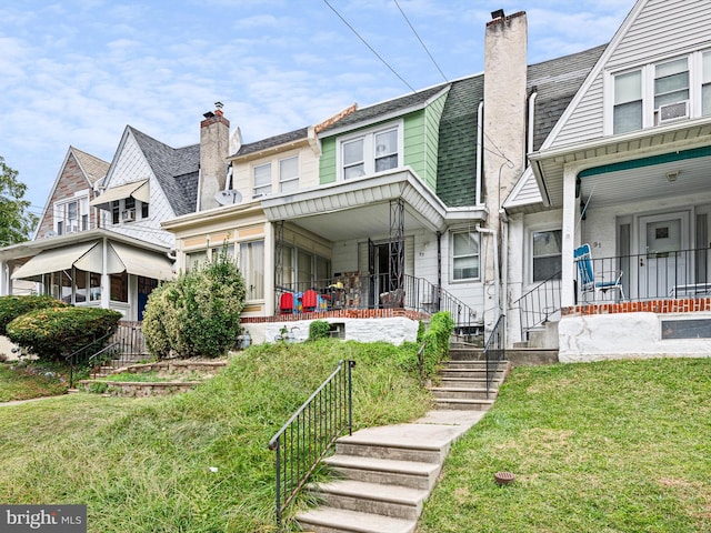 exterior space with a lawn and a porch