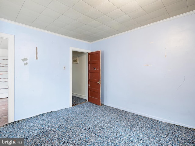 carpeted empty room with crown molding