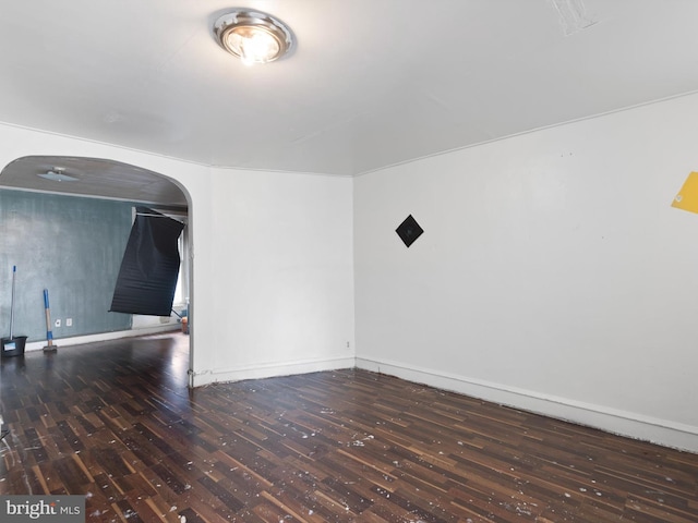 spare room featuring dark hardwood / wood-style floors