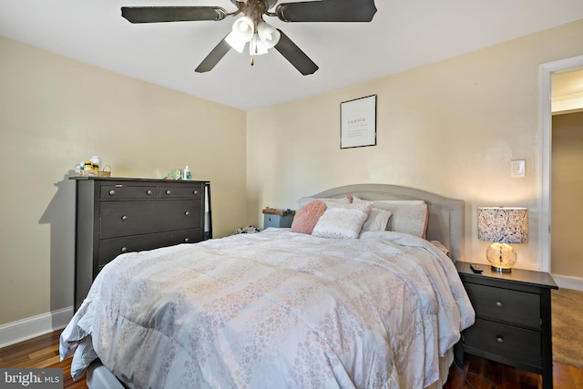 bedroom with ceiling fan and dark hardwood / wood-style flooring