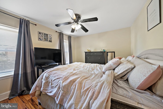 bedroom featuring ceiling fan and dark hardwood / wood-style flooring