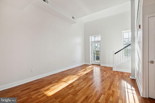 unfurnished living room with light hardwood / wood-style flooring