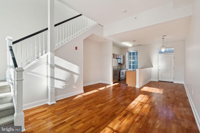 unfurnished living room with hardwood / wood-style floors