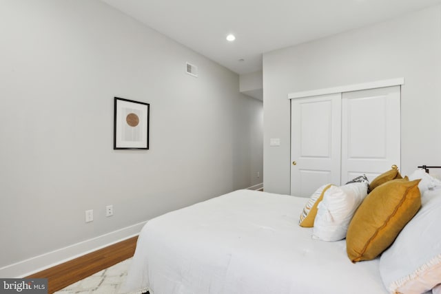 bedroom featuring a closet and hardwood / wood-style floors