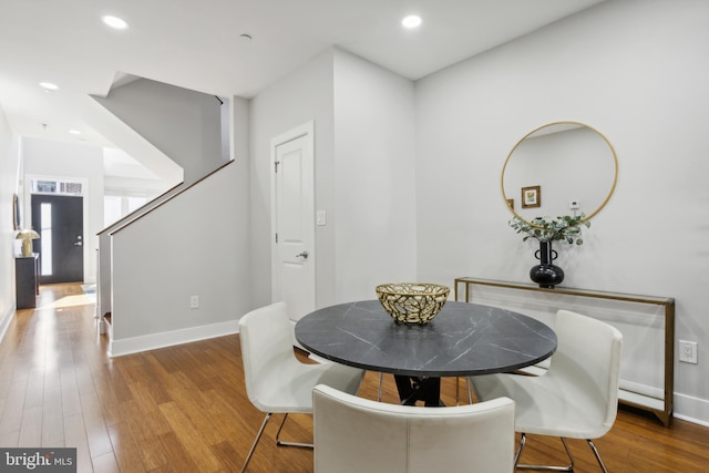 dining space with light hardwood / wood-style flooring