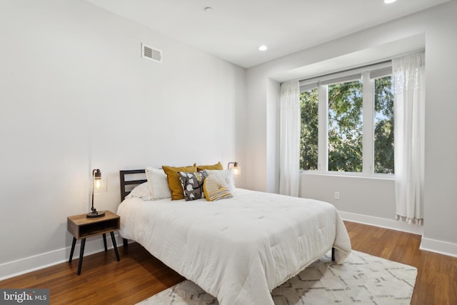 bedroom featuring wood-type flooring