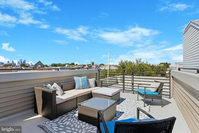 view of patio / terrace with a balcony and an outdoor living space