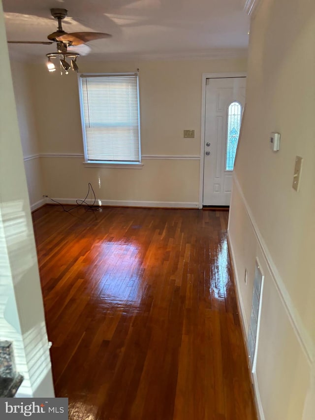 entryway featuring dark wood-type flooring and ceiling fan