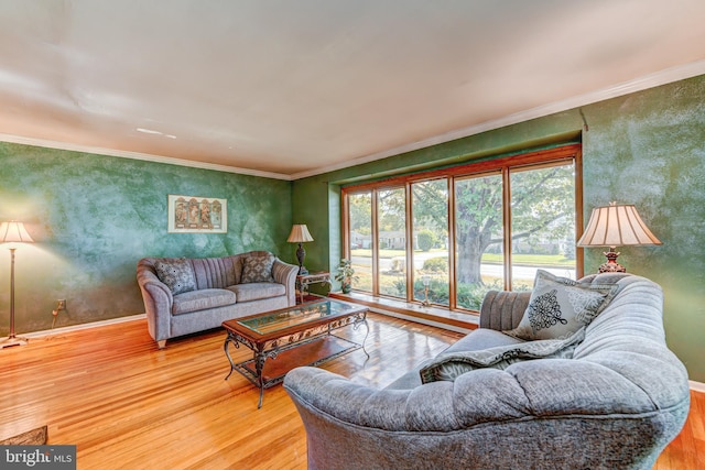 living room featuring hardwood / wood-style flooring and ornamental molding