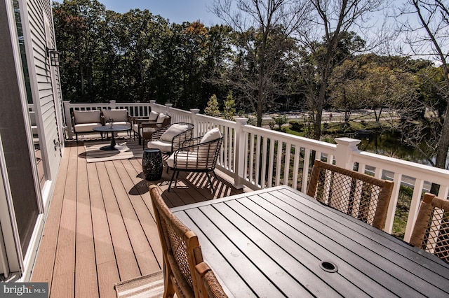 deck featuring a water view