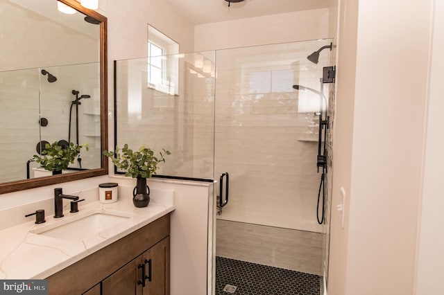 bathroom with vanity and walk in shower