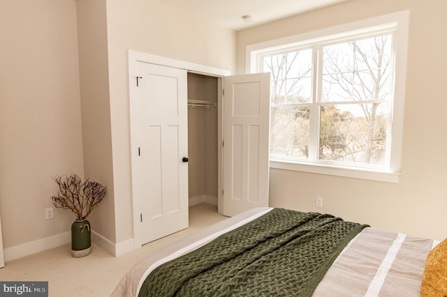 carpeted bedroom featuring a closet