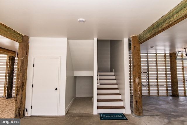 stairs with concrete floors