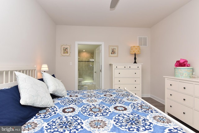 bedroom with wood-type flooring, ensuite bathroom, and ceiling fan