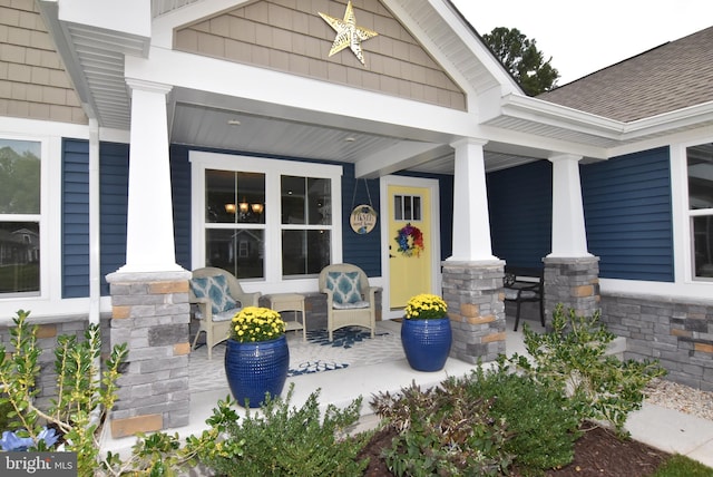 property entrance featuring covered porch