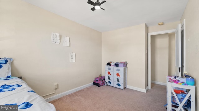 bedroom with light colored carpet and ceiling fan